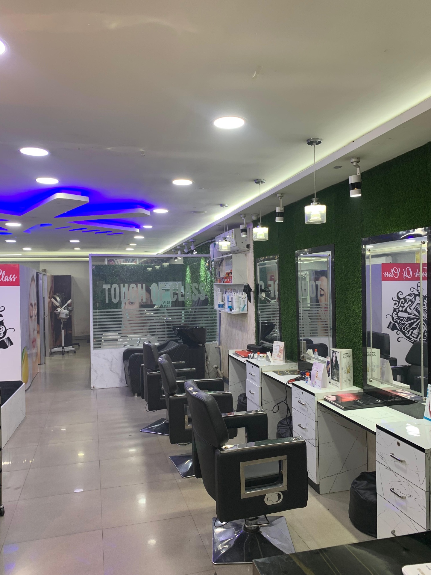 Styling floor with mirrored stations at Touch of Class salon