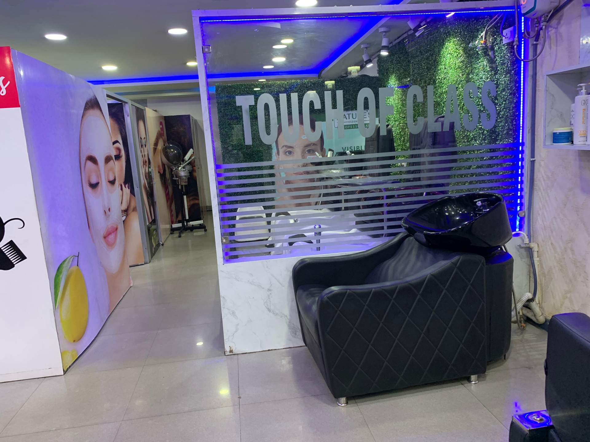 Touch of Class branded salon lounge with hair wash station in Bistupur