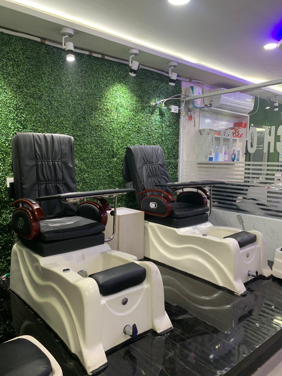 Pedicure lounge seating at Touch of Class salon